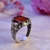 The Phoenix Ember: Men’s Red Agate Sterling Silver Ring with Winged Filigree
